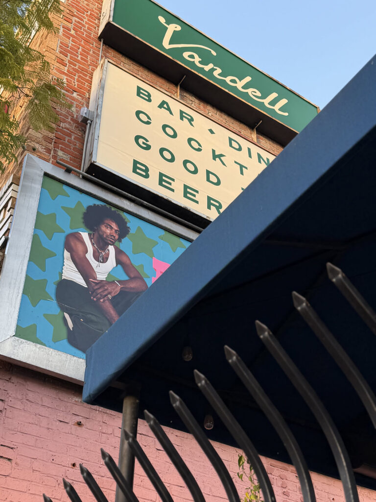 Vandell brick exterior with green sign and mural on Hillhurst Avenue in Los Feliz