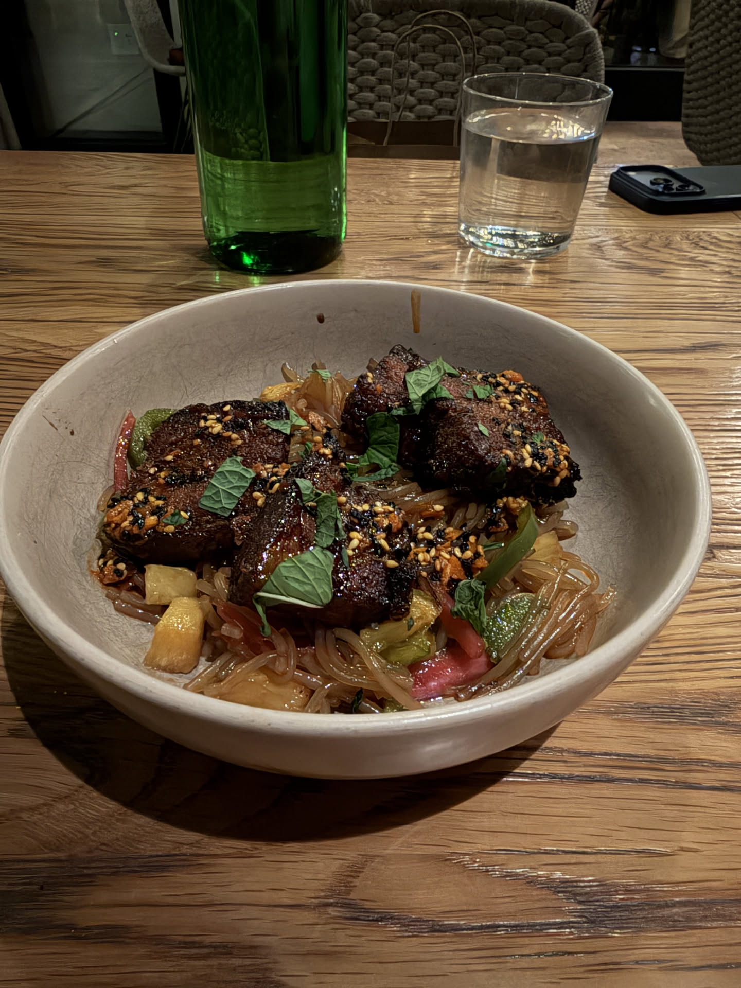 Pork belly noodles with grilled pineapple and chili crunch at Girl and the Goat